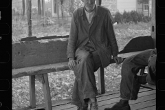 0165_Man on bench outside  Post Office 