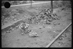 0709_Miner's son with bag of coal,