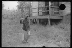 0753_Mexican  miner carrying water