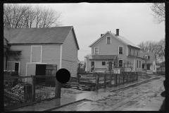 1168_Newer houses on street, possible flood damage