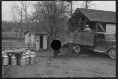 1232_Truck in yard of probable dairy farm ( churns) ,