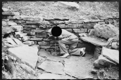 1247_Inspecting a dry stone retaining wall 