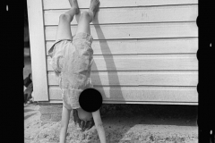 1319_ Youngster performing  a handstand , unknown location