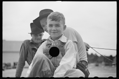 01549_ A group of youngsters possibly on a  farm cart 