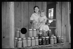 1633_ Unknown Wife with child on porch with Kilner jars of preserves