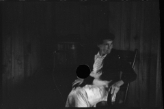 1724_Unknown  female , in dark interior , unknown location