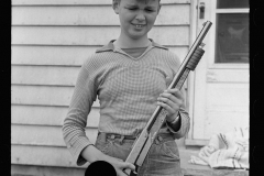 1975_Young lad with simple toy rifle ,  Decatur Homesteads