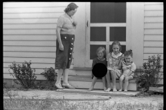 2027_Mother with children sitting on the step ,Wabash  Farms