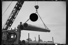 2260_Unloading a sewer pipe by crane, Greenbelt construction