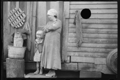 2445_Rehabilitation client's wife and child  in the doorway of their home , Jackson County, Ohio