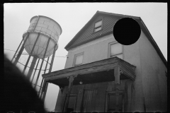 2526_ Dwelling in shocking condition with  water tower, Northwest Manville 