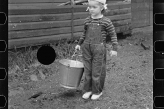 2774_Yound daughter with pail , rehabilitation client, Lamoille County,