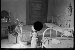 3009_Child of Edwin Gorder  in farmhouse bedroom,