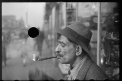 3062_Man in street with homemade pipe , Washington D.C.