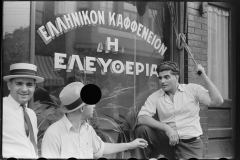 3126_Steelworkers talking to the proprietor of a coffee shop , 'Liberty'  Aliquippa, Pennsylvania]