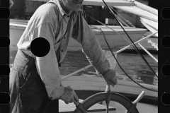 3182_Oysterman at wheel of boat, Bivalve, New Jersey