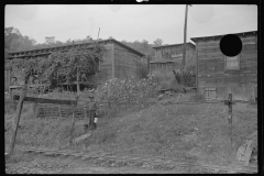 3571_Miner leaving his home , Bertha Hill, West Virginia