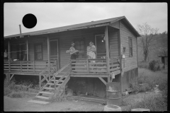 3574_Coal miner, his wife and baby living in a  company shanty , Scotts Run, West Virginia