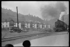 3603_Train laden with  coal passes  miners' homes, Osage , West Virginia