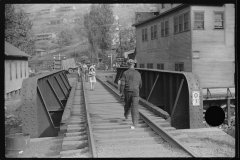 3697_Miner going home after work, children going to school