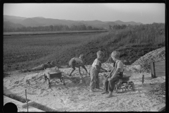 3714_Children playing in pile of sand, Tygart Valley, West Virginia