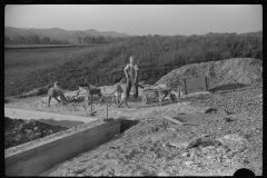 3894_ Children playing in pile of  sand, Tygart Valley, West Virginia