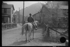 3913_Miner taking home provisions, Caples, West Virginia