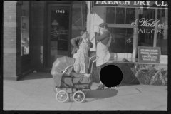 3518_Dry Cleaners , Women with baby carriage, L Street, Washington, D.C.