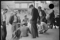 3732_Miners playing cards outside company store, Chaplin
