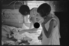0008_Wife of sharecropper with  sick child