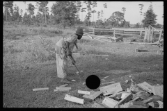 0058_Black_American boy chopping wood, Tangipahoa Parish , Louisiana