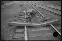 0744_Track worker cutting a steel section with a welding torch , unknown location