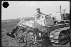 0787_  Powered rear cultivator on tracked vehicle.