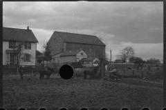 1220_Traditional ploughing behind houses , locational unknown