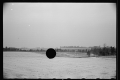 1400_ Open snowy landscape , agricultural land , unknown location.