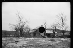 01603_Modest settler fenced with stock , homestead , unknown location