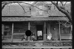 1609_Women sitting on the porch , traditional   homestead