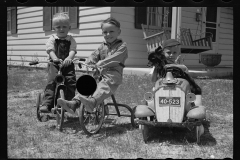 1650_ Three young boys, trikes and pedal car