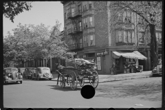 1972_Horse and cart full of lumber passes Unites Food Stores