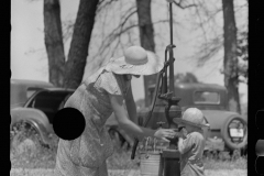 1989_Mother at pump (water) with child drinking .