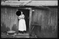 2440_Rehabilitation client's wife in he doorway of her home , Jackson County, Ohio