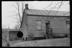 2457_Resettlement Administration representatives at door of client's house