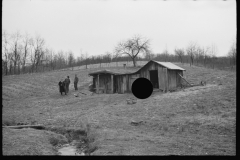 2462_Resettlement Administration representative outside client's  house/shack , Jackson County