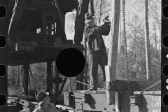 2989_Loading device moving railroad cars full of timber at camp near Effie, Minnesota