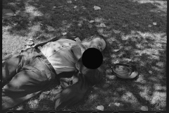 2994_Transient labourer asleep in park, Gateway District, Minneapolis, Minnesota