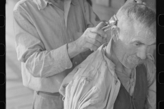 3556_Miners often gave haircuts on the front porch. The "Patch," Chaplin, West Virginia