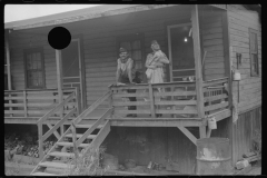 3573_Coal miner, his wife and baby living in a  company shanty,  Scotts Run, West Virginia