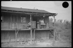 3586_Haircutting  on front porch . Chaplin, West Virginia