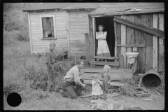 3594_Coal miner and some of his family in back of their home. Bertha Hill, West Virginia