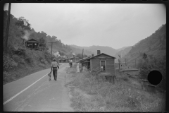 3812_Carrying water to abandoned mining community,